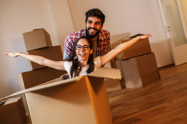 istock Young couple moving into a new home 1273881171