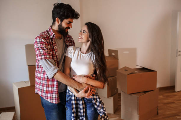 istock Young couple moving into a new home. 1273881180