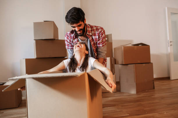 istock Young couple moving into a new home 1273881196