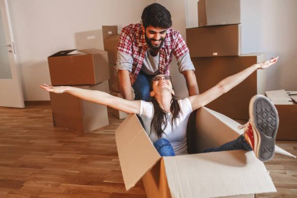 istock Young couple moving into a new home 1273881252