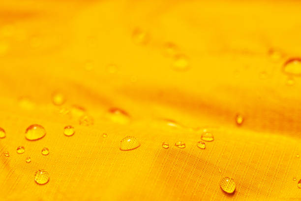 istock Water drops on the orange waterproof fabric 1273881485