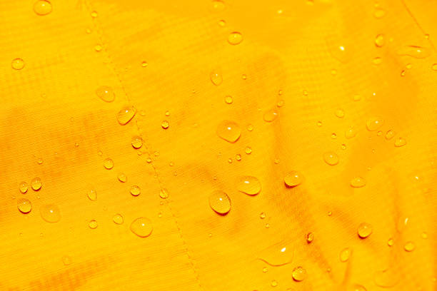 istock Water drops on the orange waterproof fabric 1273881647