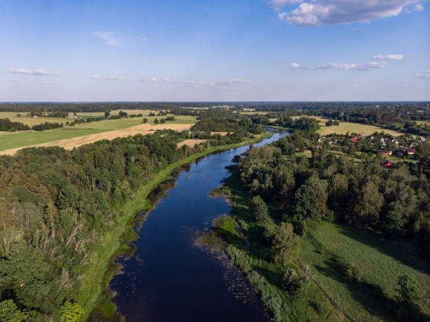 istock Areal countryside view from drone with small river Venta. 1273886825