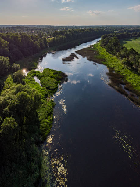 istock Areal countryside view from drone with small river Venta. 1273886835