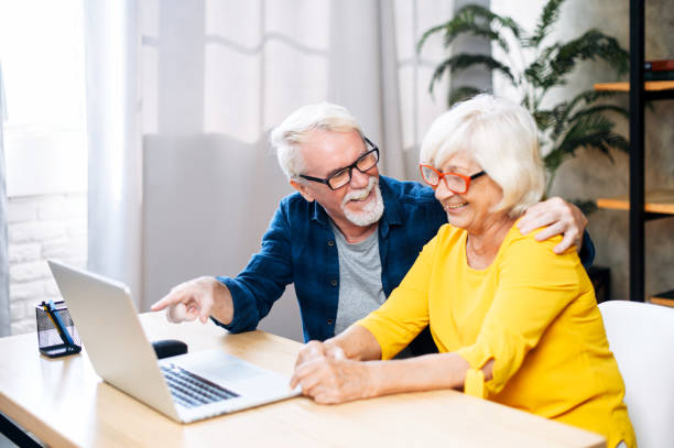 istock A happy senior couple is using the laptop indoor 1273888473