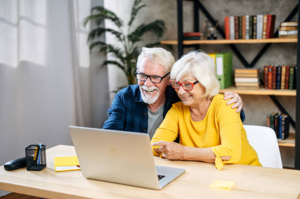 istock A happy senior couple is using the laptop computer indoor 1273888479