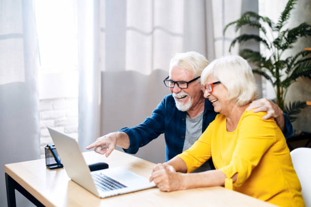 istock A happy senior couple is using the laptop indoor 1273888525