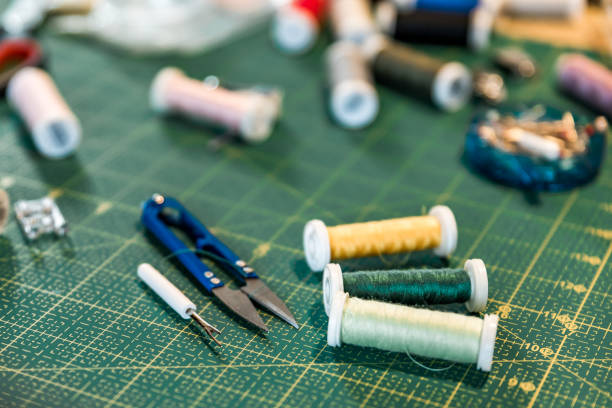 istock Top view of sewing accessories on cutting mat: pins, sewing threads, clippers.Sewing flat lay. 1273888984