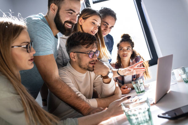 istock Group of programmers an designers in conference room. 1273889954