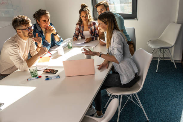 istock Group of programmers an designers in conference room. 1273889965