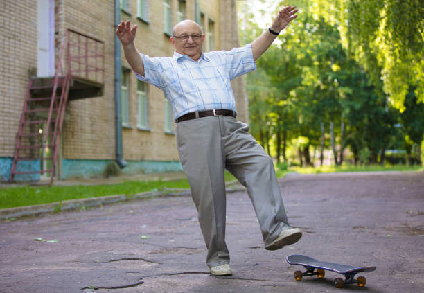 istock An elderly man learns to ride a skateboard. A modern pensioner. 1273889991