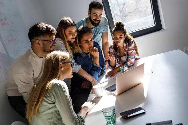 istock Group of programmers an designers in conference room. 1273890005