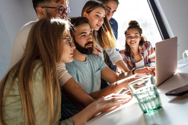 istock Group of programmers an designers in conference room. 1273890030