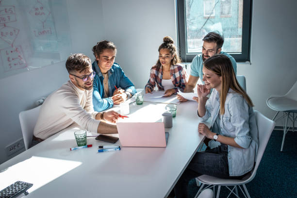 istock Group of programmers an designers in conference room. 1273890049