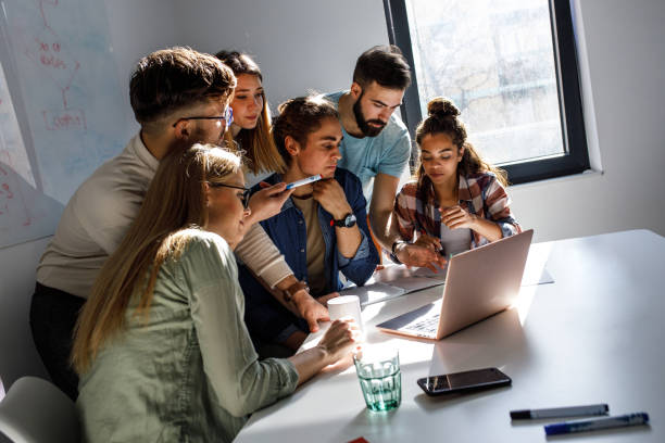 istock Group of programmers an designers in conference room. 1273890057