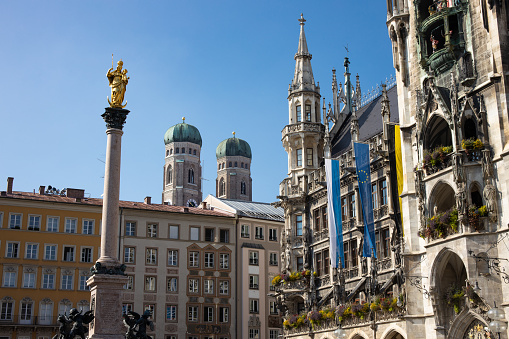 Munich Marienplatz with the city hall with the Glockenspiel, the Marian Column and in the background the Church of Our Lady (Frauenkirche)