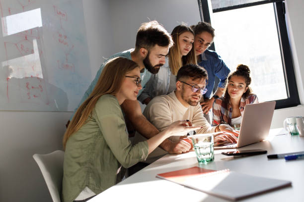 istock Group of programmers an designers in conference room. 1273890121