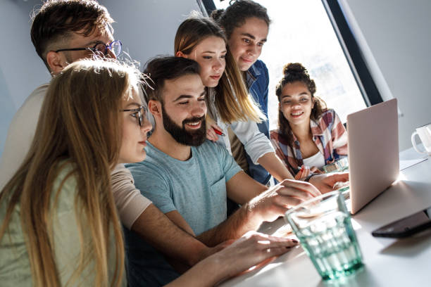istock Group of programmers an designers in conference room. 1273890160