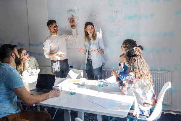 istock Group of programmers an designers in conference room. 1273890319