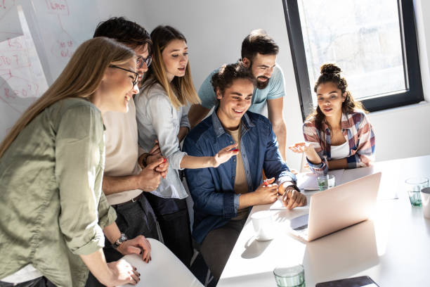istock Group of programmers an designers in conference room. 1273890690