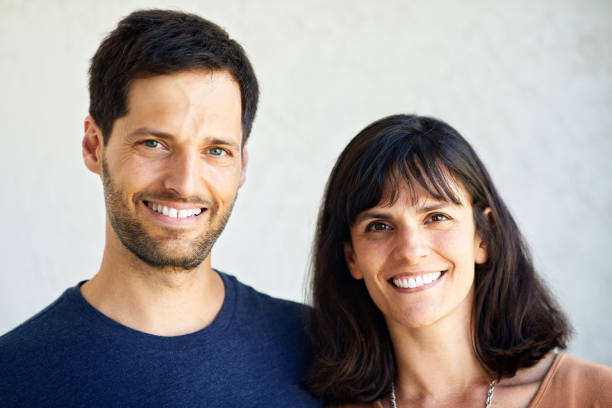 istock An Argentinian couple headshot portrait looking at camera. 1273894208