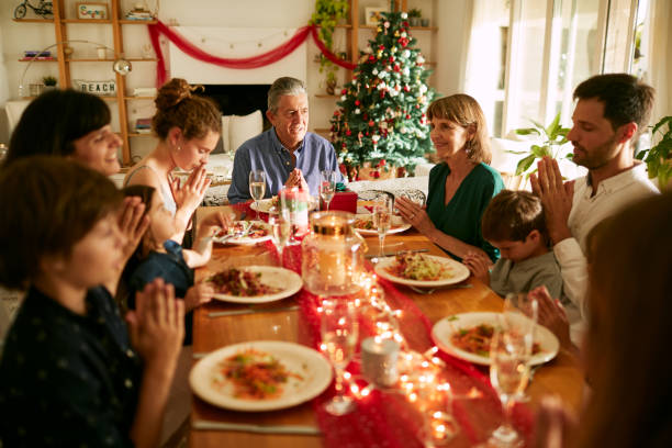 istock A family praying before Christmas dinner in Buenos Aires 1273894640