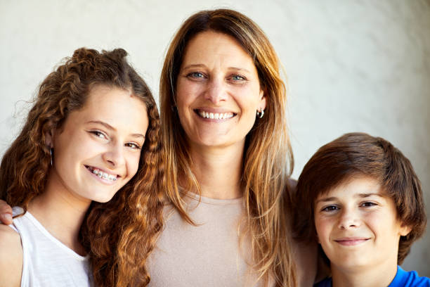 istock A mother with two child portrait looking at camera. 1273894952