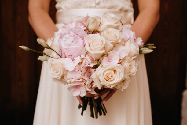 istock Bride holding her wedding bouquet 1273895654