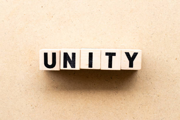 istock Letter block in word unity on wood background 1273896487