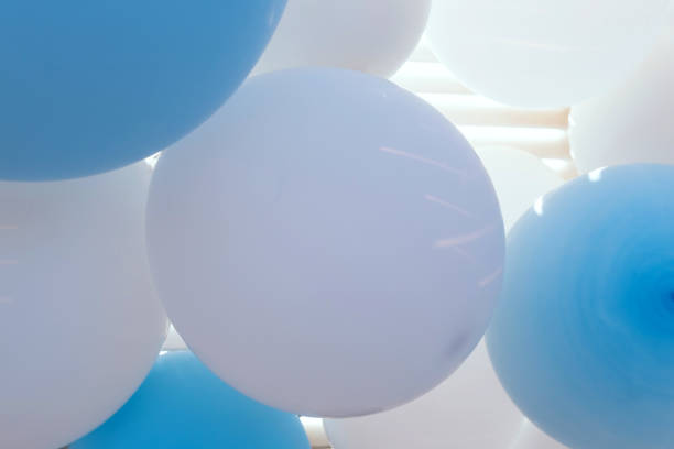istock Background of white and blue balloons 1273896602