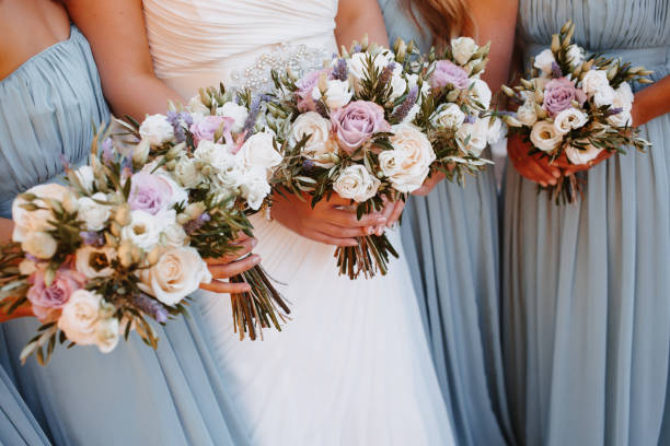 istock Bride and bridesmaids holding their wedding bouquets 1273896633