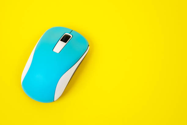 istock The blue computer mouse on yellow background. Isolated, studio, indoors, copy space for any text or design 1273897441