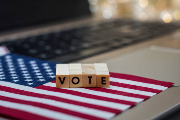 istock VOTE letter blocks concept on laptop keyboard 1273898243
