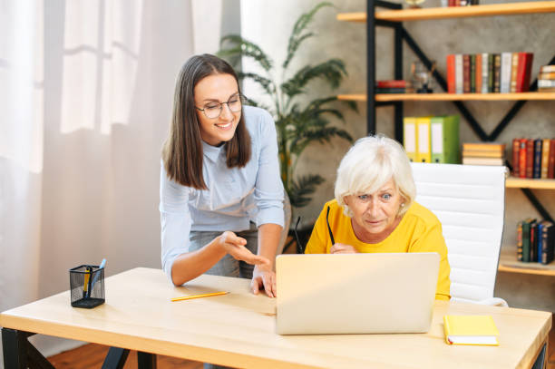 istock Two female colleagues in the office using a laptop 1273898960