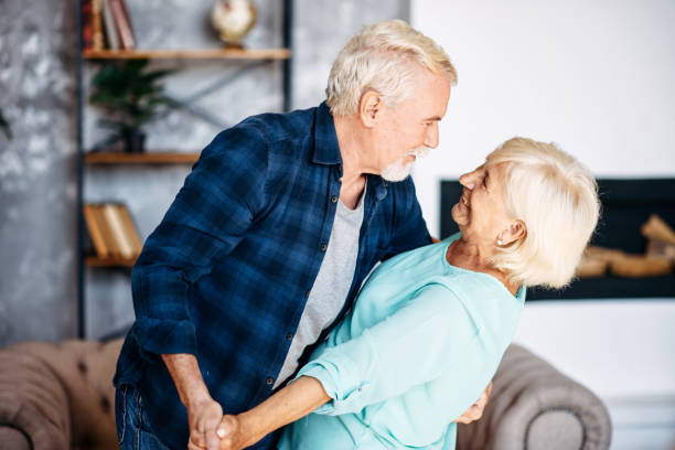 istock Romantic modern senior couple hagging indoors 1273898973