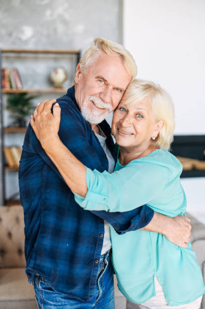 istock Romantic modern senior couple hagging indoors 1273899012