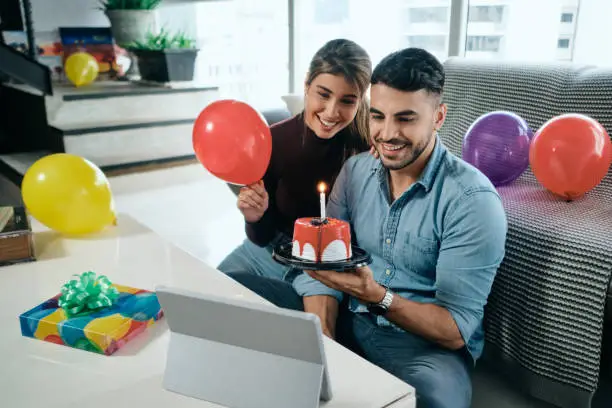 Photo of Happy People Celebrating Birthday Party Doing Video Call