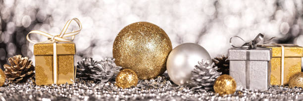 istock panorama with shiny gold and silver christmas decoration 1273904039