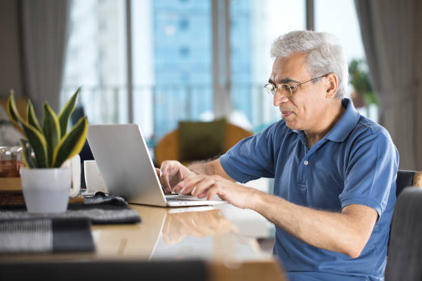 istock Senior man working from home 1273906657
