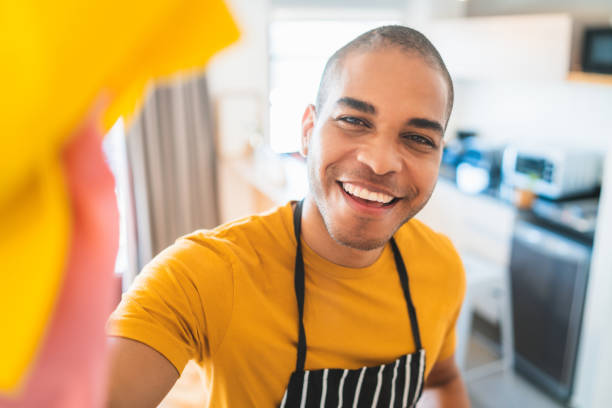 istock Latin man cleaning new home. 1273909738