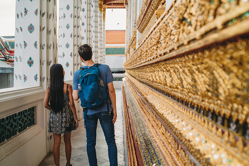 Young couple exploring a temple in Bangkok