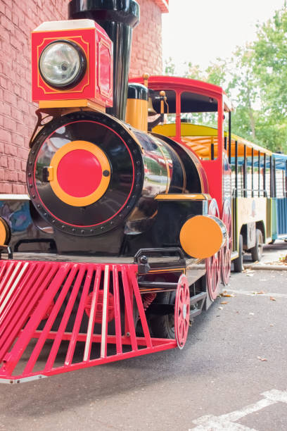 istock Multi-colored electric locomotive attraction for children 1273914478
