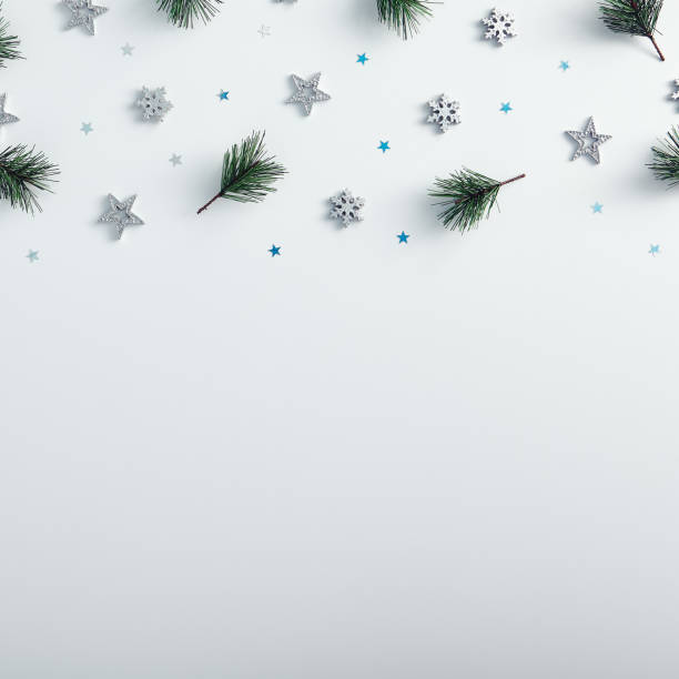 istock Pine branch, silver snowflake and star on the top 1273914720