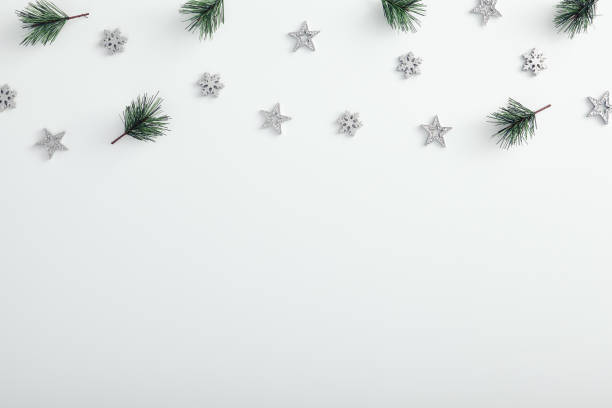 istock Mock up with pine branch, silver snowflake and star over white 1273914725
