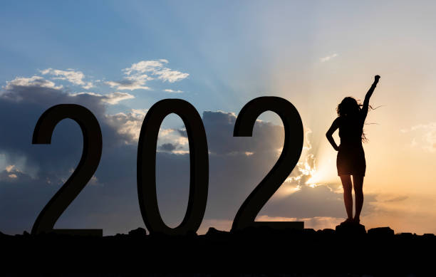 Woman enjoying on the hilll while celebrating new year 2021 Woman enjoying on the hilll while celebrating new year 2021 21st century stock pictures, royalty-free photos & images