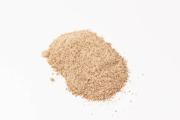 istock Powdered black ground pepper pile from top on white background 1273917641