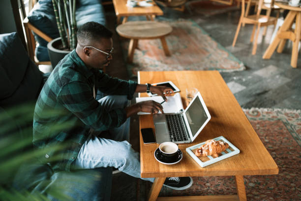 istock Side view of a young African American man working 1273917965