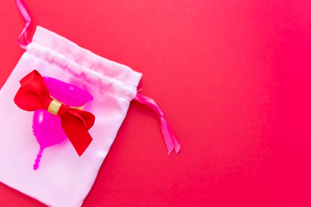 istock Menstrual cup as a gift, flat lay on pink background. Zero waste concept. 1273918051