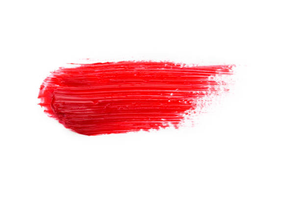 istock Lipstick smear smudge swatch isolated on white background. Cream makeup texture. Bright red color cosmetic product brush stroke swipe sample 1273918076