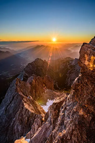 A sunrise over the alpine moutains range in Germany from  the highest peak Zugspitze.